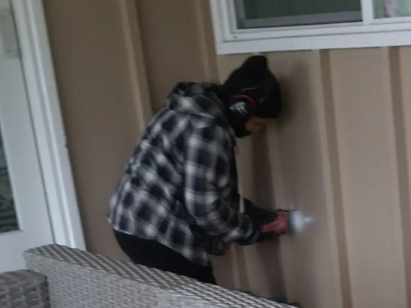 Professional electrician installing an exterior outlet in Nipomo